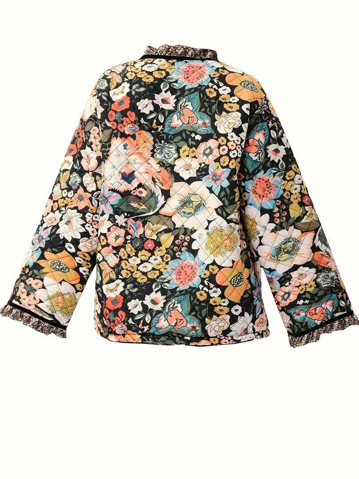 Eloise - Omarm elk seizoen met de gebloemde Whisper jas!